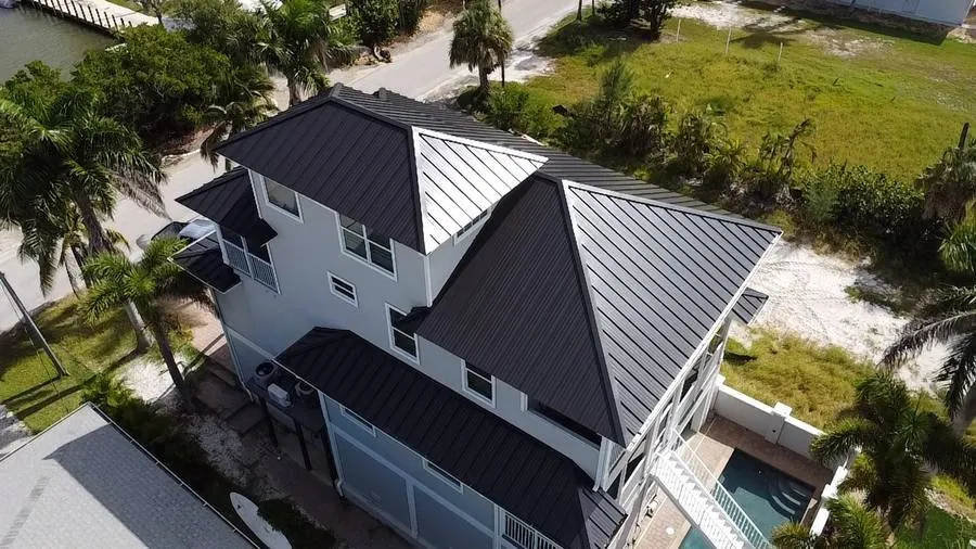 Standing seam metal roof on a Cape Coral, FL waterfront home by Coastline Construction