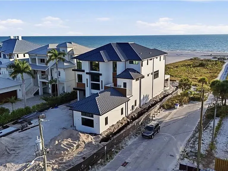 Beachfront home standing seam metal roof Southwest Florida